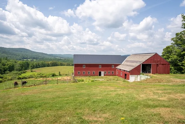 a view of a house with a big yard