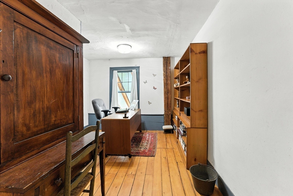 85 Dacey Road Conway, MA 01341 - Photo 32 of 42 a view of a living room filled with furniture and wooden floor