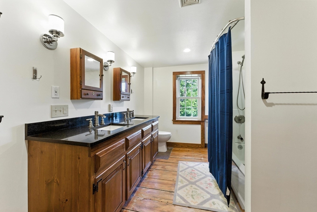 85 Dacey Road Conway, MA 01341 - Photo 33 of 42 a kitchen with granite countertop a sink and cabinets