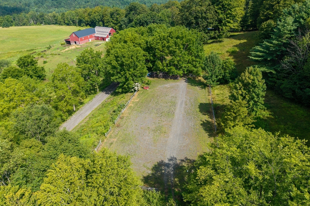 85 Dacey Road Conway, MA 01341 - Photo 40 of 42 a view of a lake with a flower garden