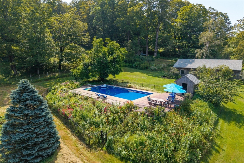 85 Dacey Road Conway, MA 01341 - Photo 6 of 42 a view of a garden with a lake