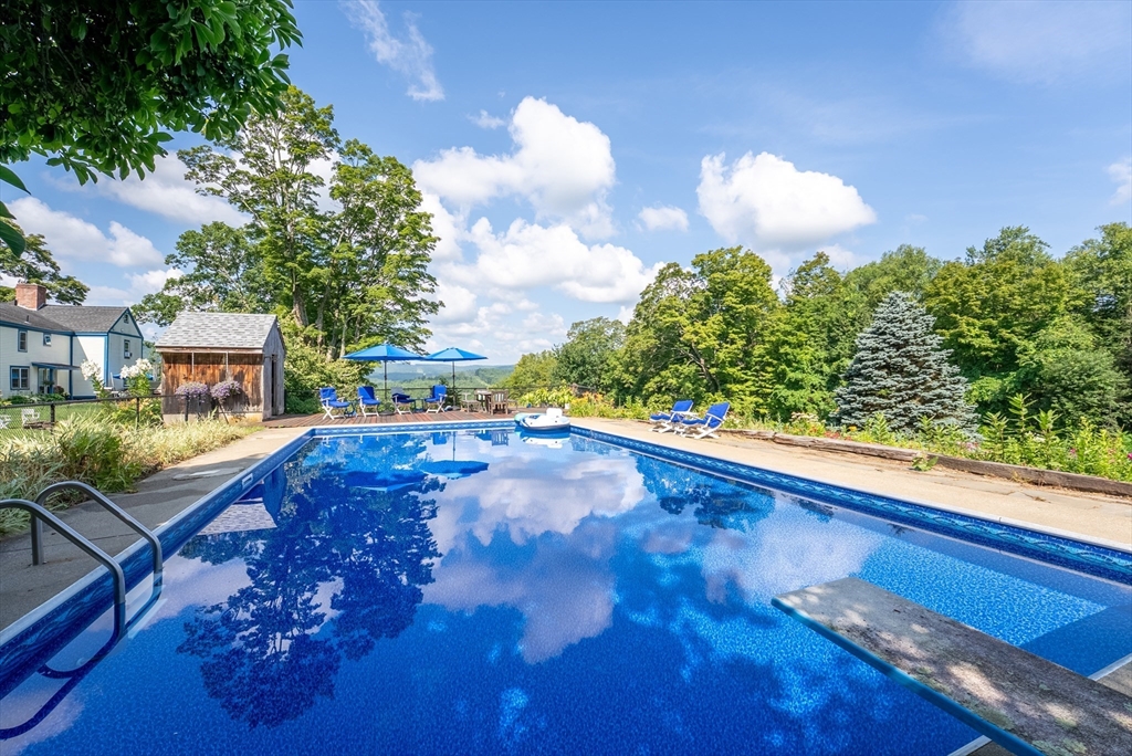 85 Dacey Road Conway, MA 01341 - Photo 7 of 42 a view of a balcony with an outdoor space and seating area