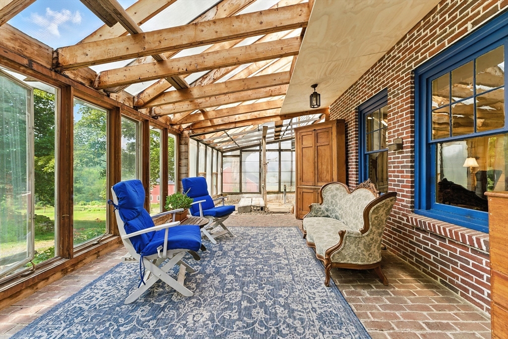85 Dacey Road Conway, MA 01341 - Photo 9 of 42 a living room with furniture and a floor to ceiling window