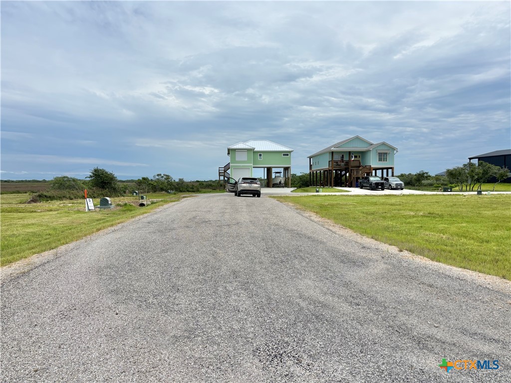 10 Boca Grande Loop Port O'Connor, TX 77982 - Photo 29 of 45 front view of a house with a yard and a large trees