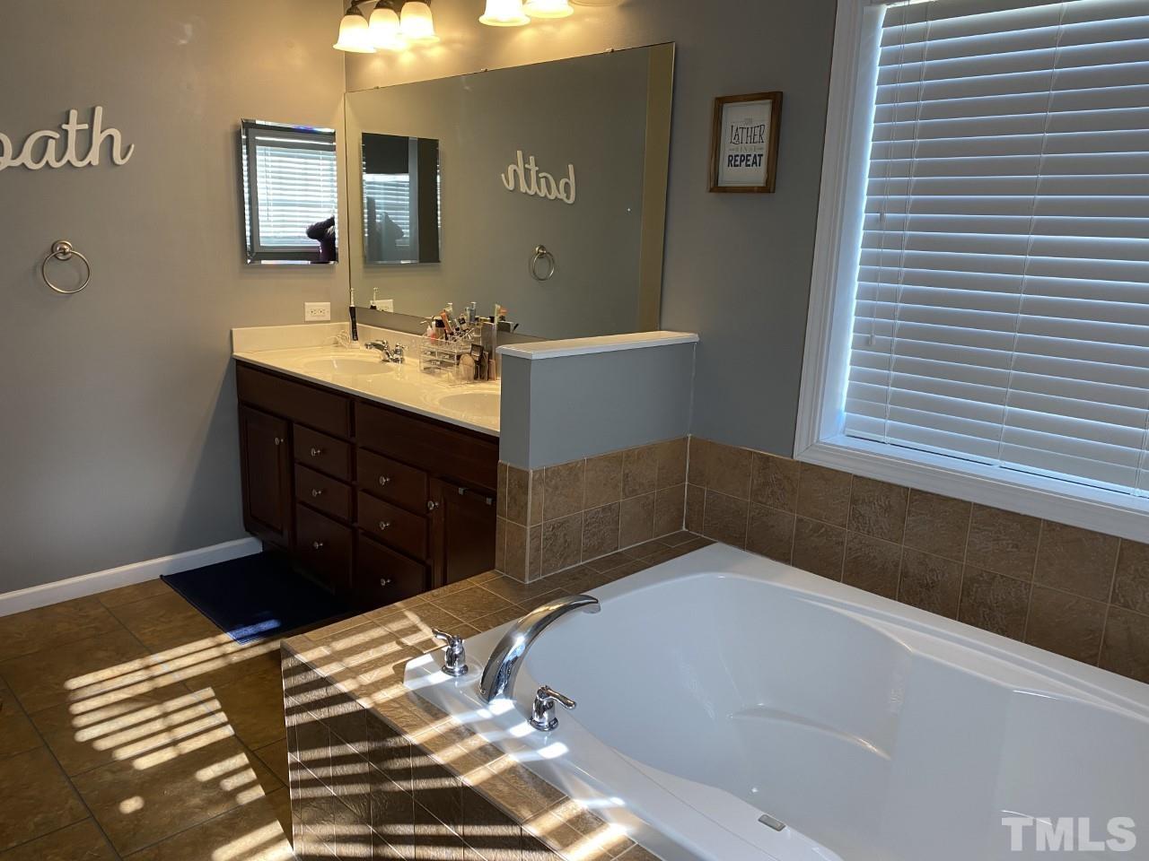 274 South Chaucer Way Kittrell, NC 27544 - Photo 16 of 28 a bathroom with a sink and a mirror