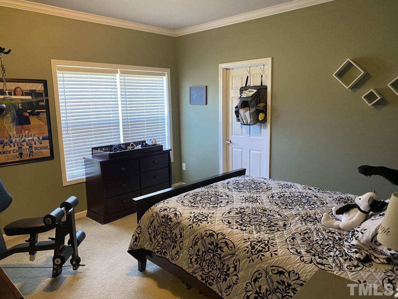 274 South Chaucer Way Kittrell, NC 27544 - Photo 17 of 28 a bedroom with a bed and a workspace