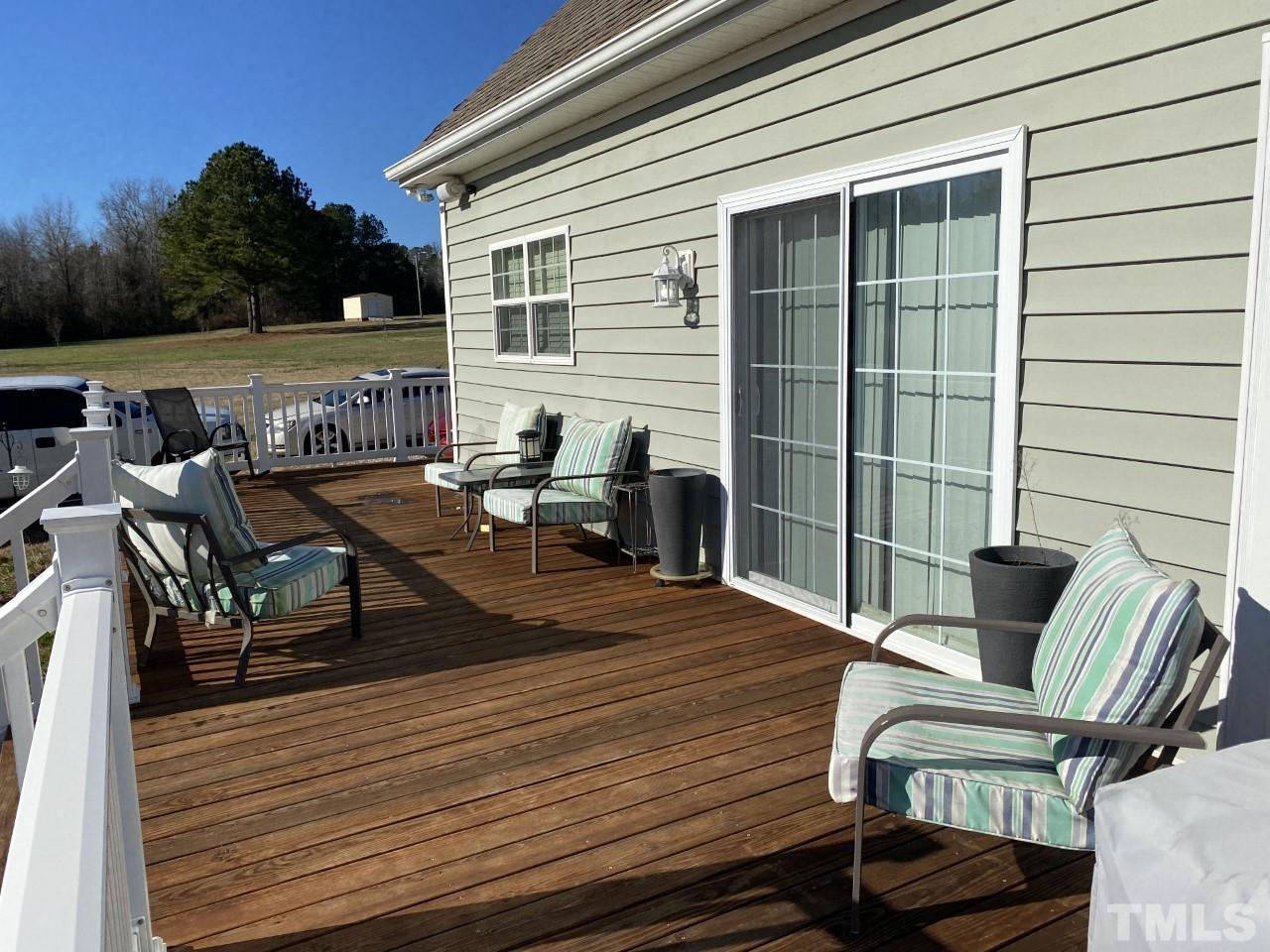 274 South Chaucer Way Kittrell, NC 27544 - Photo 26 of 28 a view of a balcony with two chairs and wooden floor