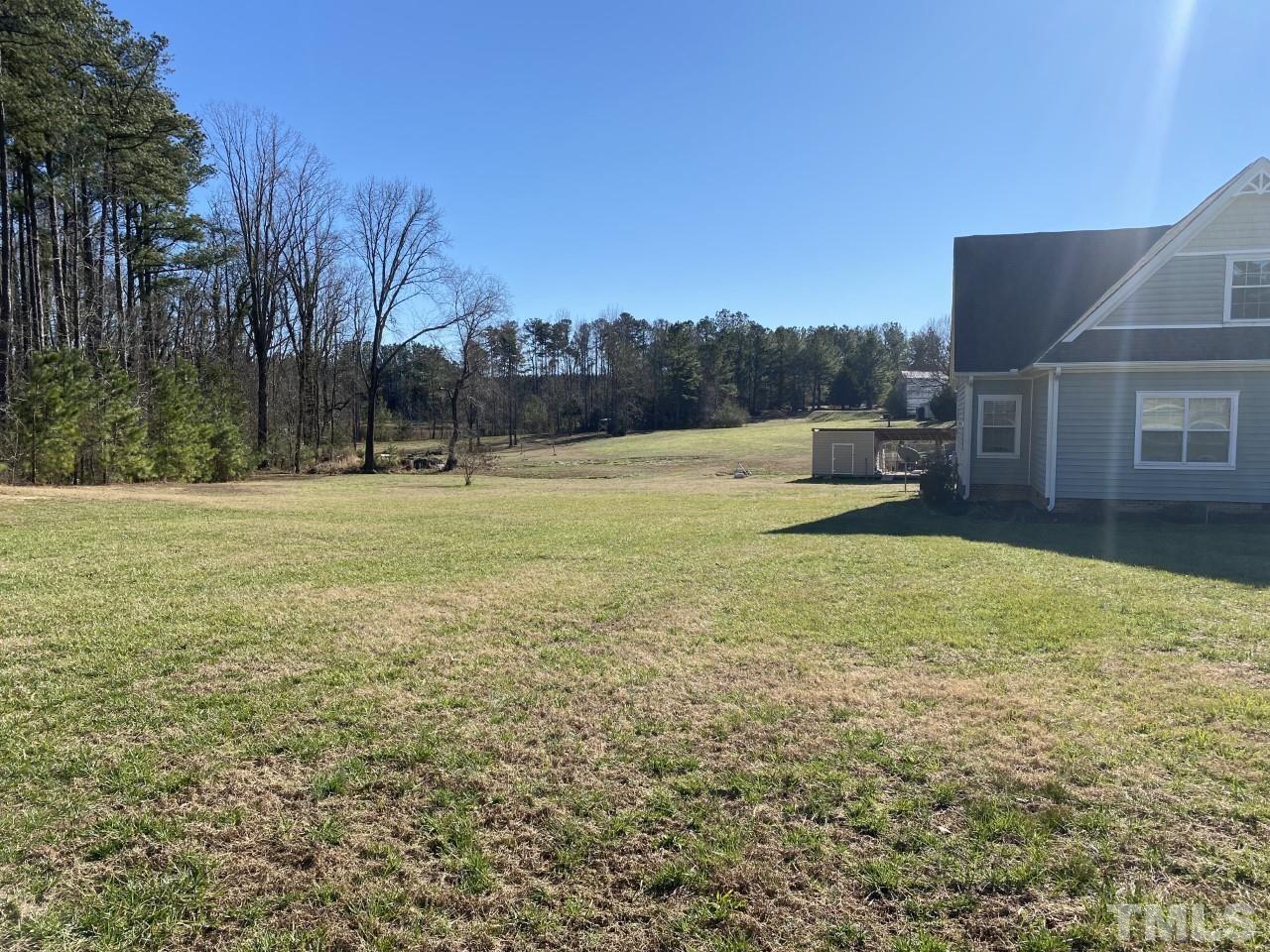 274 South Chaucer Way Kittrell, NC 27544 - Photo 28 of 28 a view of a swimming pool with an outdoor seating and a yard