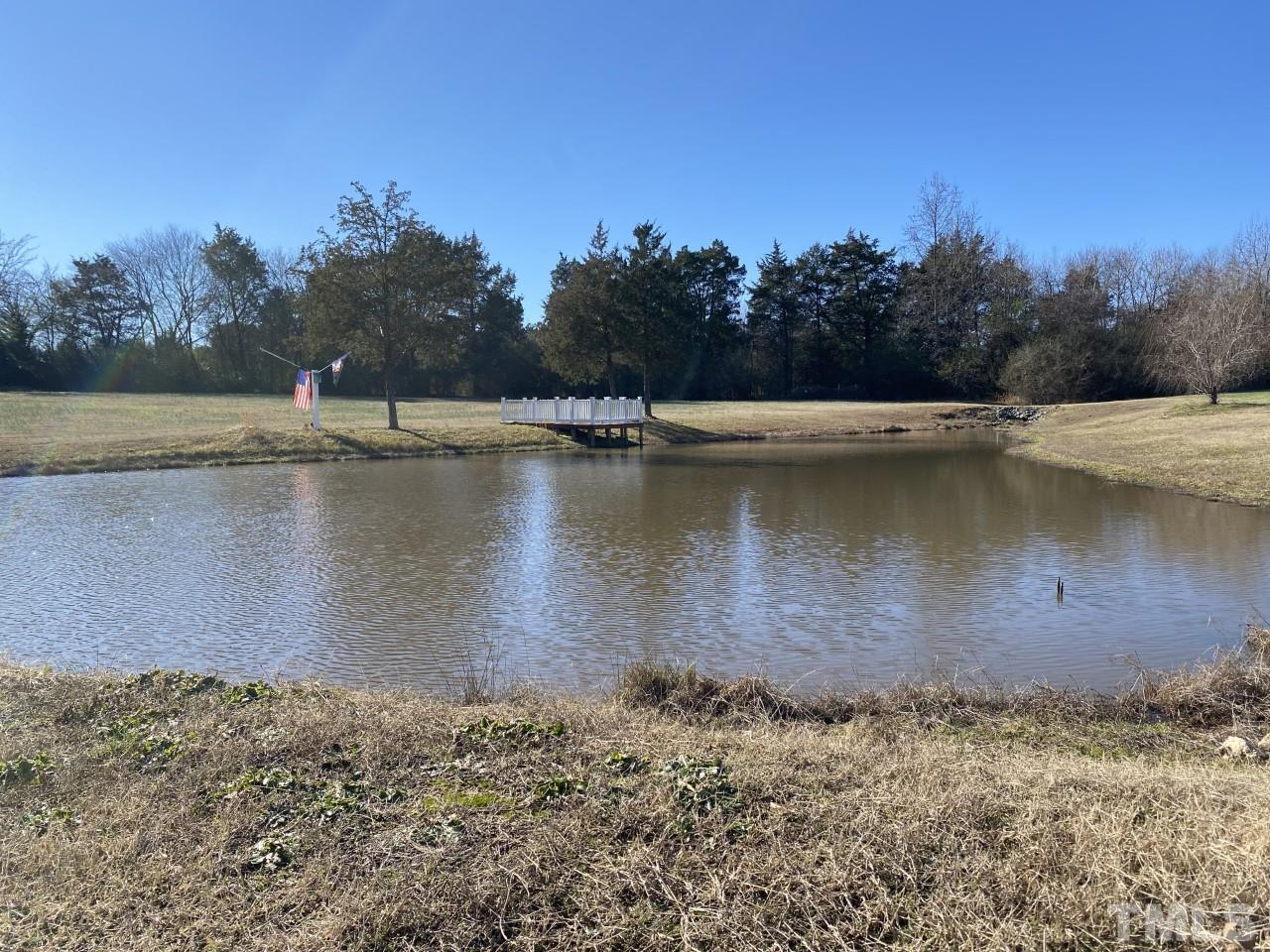 274 South Chaucer Way Kittrell, NC 27544 - Photo 3 of 28 a view of a lake with trees in the background