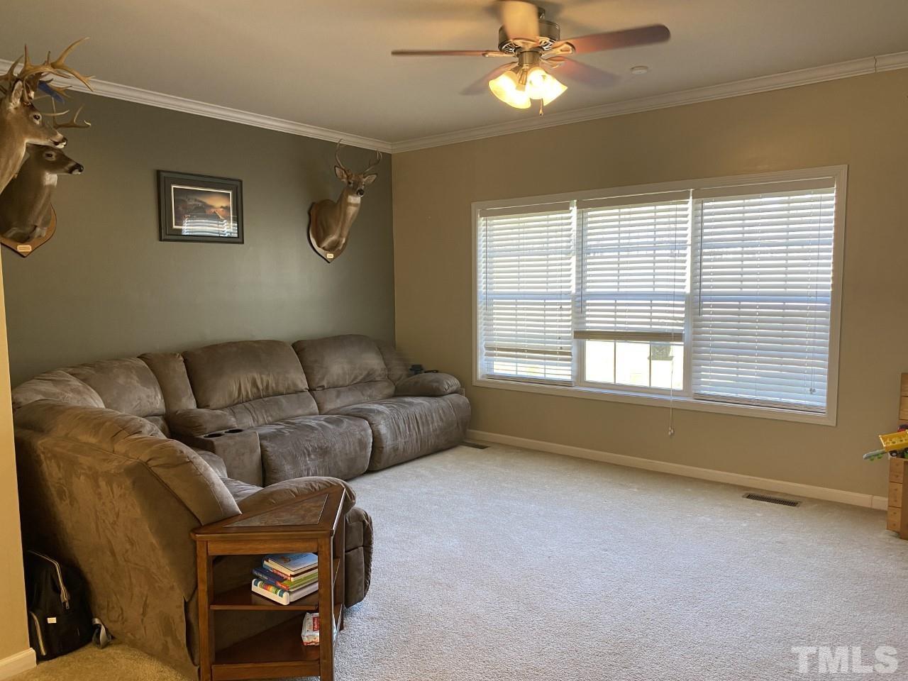 274 South Chaucer Way Kittrell, NC 27544 - Photo 9 of 28 a living room with furniture and a large window