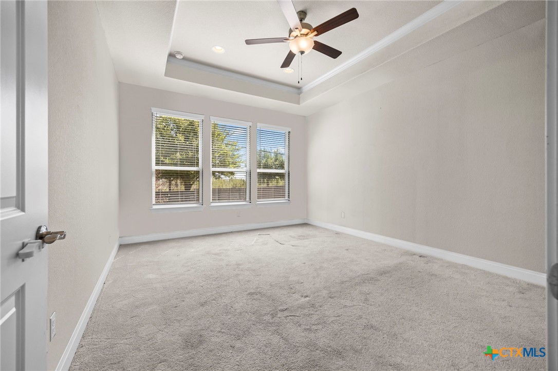 18215 Winnow Way Pflugerville, TX 78660 - Photo 15 of 21 an empty room with windows and fan