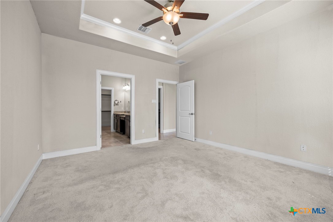 18215 Winnow Way Pflugerville, TX 78660 - Photo 16 of 21 an empty room with chandelier fan and closet area