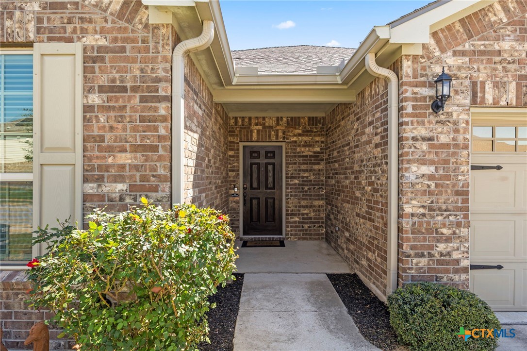 18215 Winnow Way Pflugerville, TX 78660 - Photo 2 of 21 a front view of a house with a garden