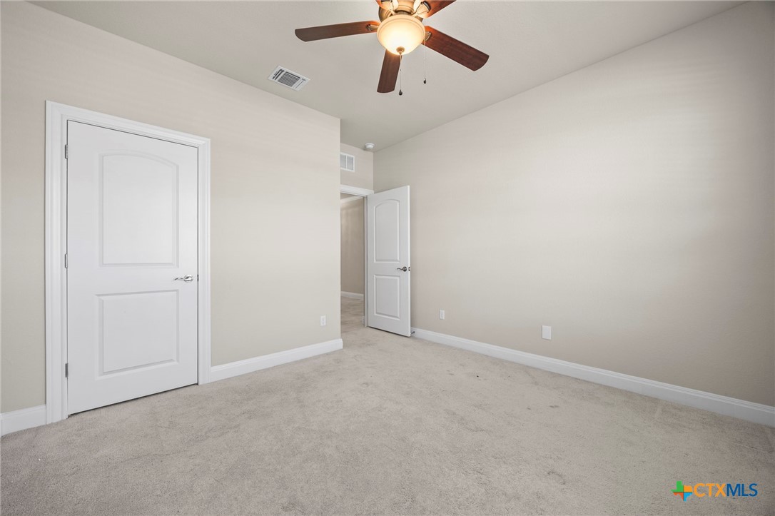 18215 Winnow Way Pflugerville, TX 78660 - Photo 9 of 21 an empty room with chandelier fan