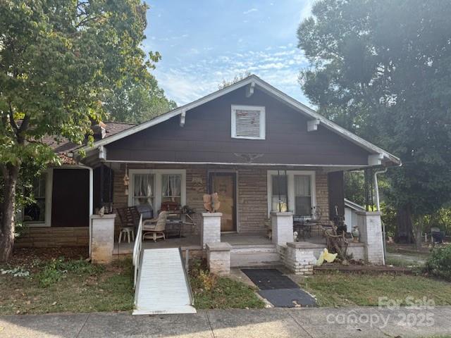 703 South Main Street Morganton, NC 28655 - Photo 3 of 6 a house view with a seating space and garden