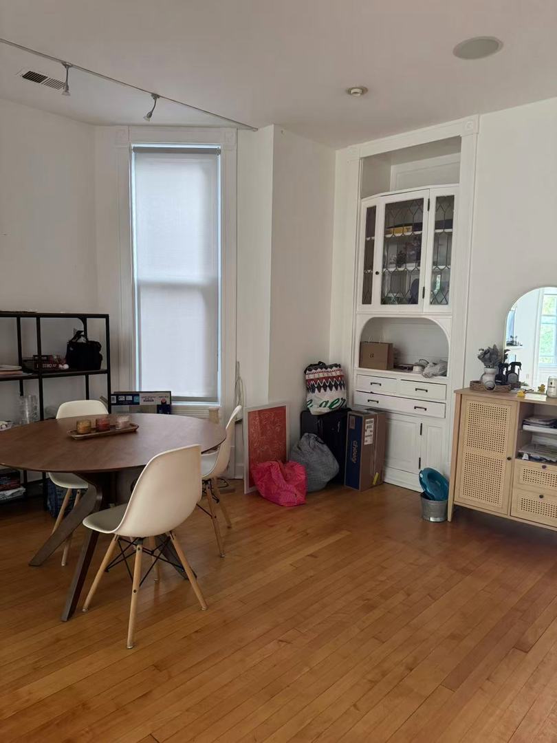 865 West Newport Avenue, Unit 3 Chicago, IL 60657 - Photo 2 of 6 a bedroom with furniture and a window