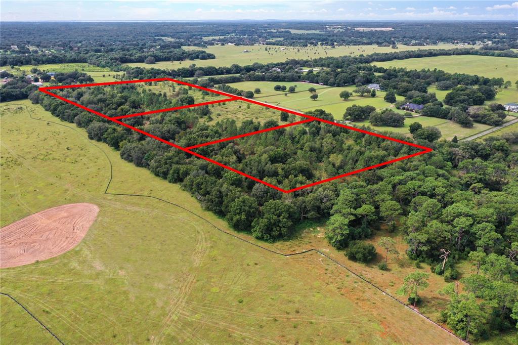 Equestrian Trail Sorrento, FL 32776 - Photo 1 of 1 an aerial view of swimming pool and mountain view