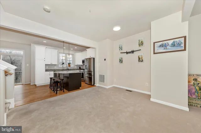 a view of a kitchen and dining room
