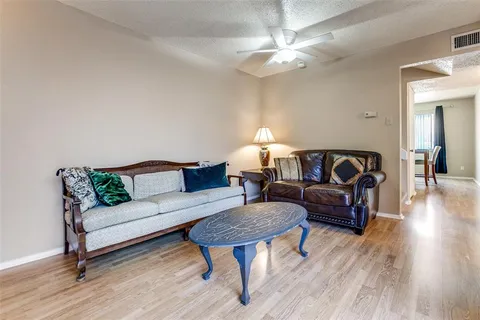 a living room with furniture and a table