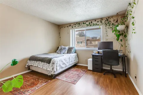 a bedroom with a bed and a chair