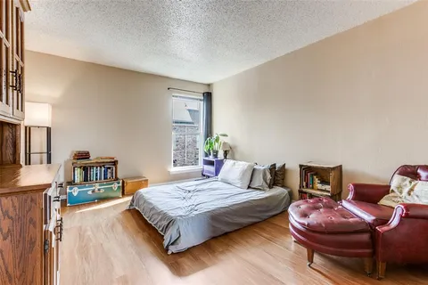 a bedroom with a bed and dresser