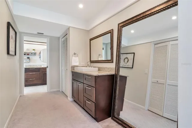 a large kitchen with stainless steel appliances granite countertop a stove a sink dishwasher and a refrigerator