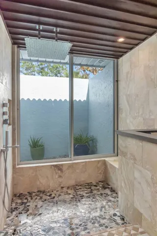 a kitchen with a sink a stove and cabinets
