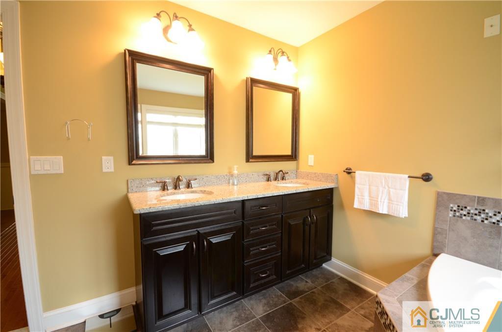 88 Dublin Road Skillman, NJ 08558 - Photo 13 of 22 a bathroom with a double vanity sink and a mirror
