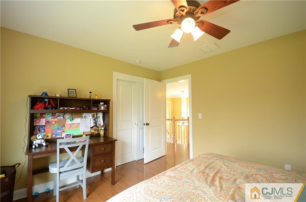 88 Dublin Road Skillman, NJ 08558 - Photo 15 of 22 a bedroom with a bed and a chandelier