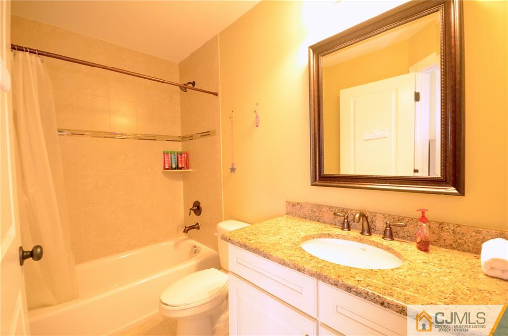 88 Dublin Road Skillman, NJ 08558 - Photo 16 of 22 a bathroom with a granite countertop sink toilet and shower