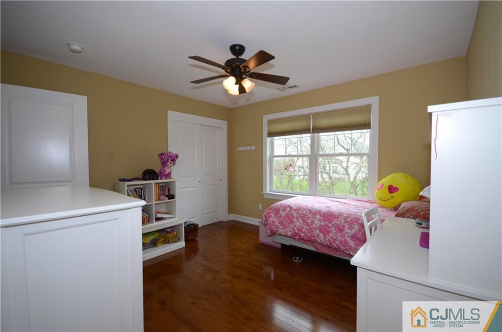 88 Dublin Road Skillman, NJ 08558 - Photo 17 of 22 a bedroom with a bed and a chandelier