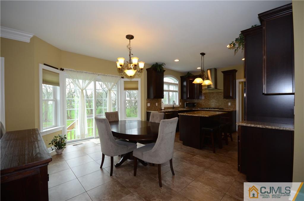 88 Dublin Road Skillman, NJ 08558 - Photo 7 of 22 a dining room with furniture and a chandelier