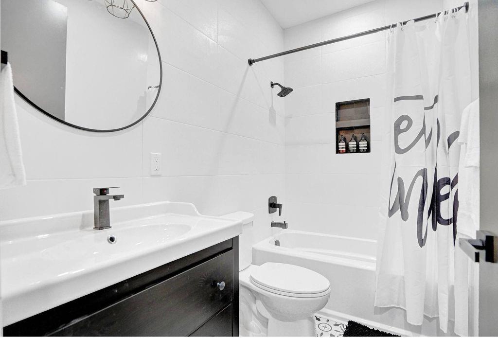 2622 Northeast 27th Avenue Lighthouse Point, FL 33064 - Photo 21 of 24 a bathroom with a sink and a mirror