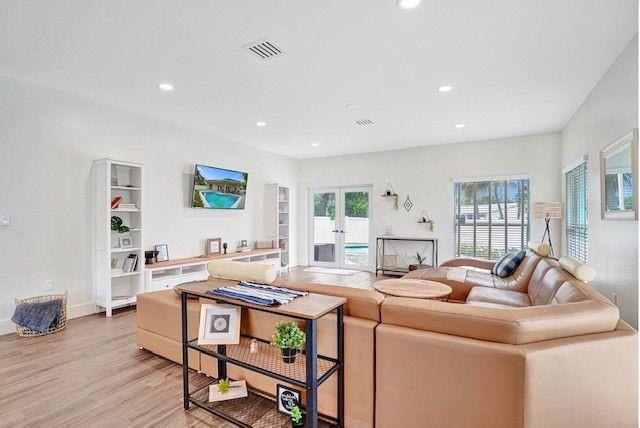 2622 Northeast 27th Avenue Lighthouse Point, FL 33064 - Photo 5 of 24 a living room with furniture and a wooden floor
