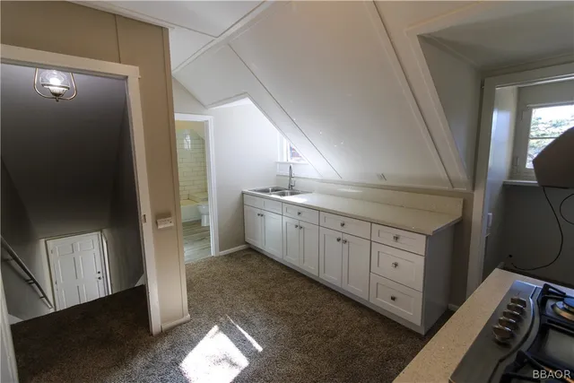 a bathroom with a double vanity sink and mirror