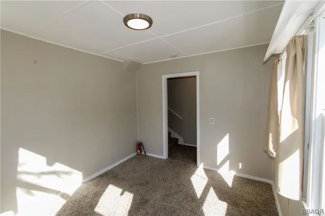 a view of empty room with windows