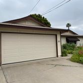 a front view of a house with garage