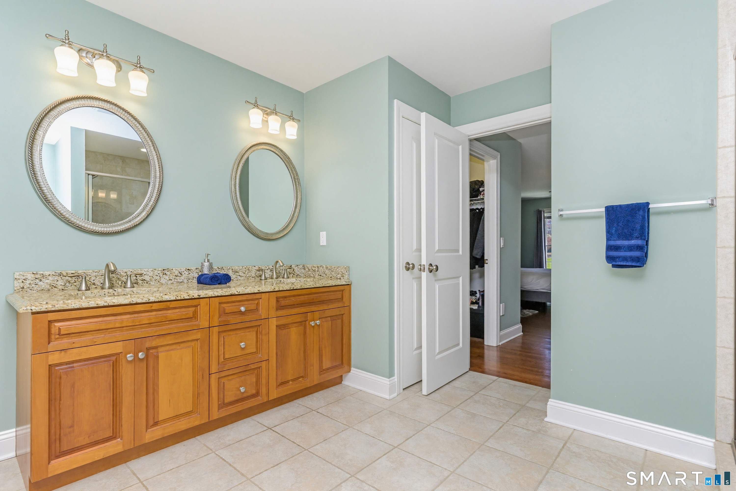 30 Block Farm Road Monroe, CT 06468 - Photo 25 of 40 a bathroom with a double vanity sink and a mirror