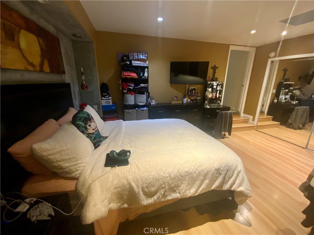 206 East Raymond Street Compton, CA 90220 - Photo 7 of 12 a bedroom with a bed and a flat screen tv