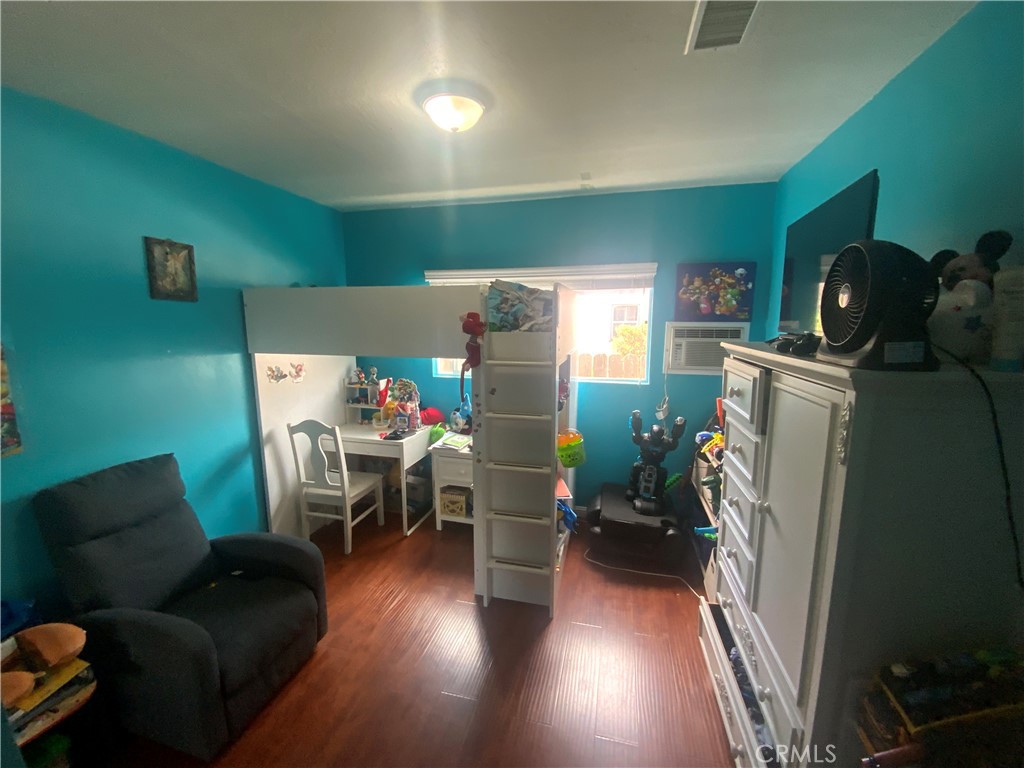 206 East Raymond Street Compton, CA 90220 - Photo 8 of 12 a living room with furniture and a wooden floor