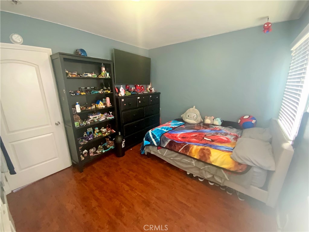 206 East Raymond Street Compton, CA 90220 - Photo 9 of 12 a bedroom with a bed window and dresser