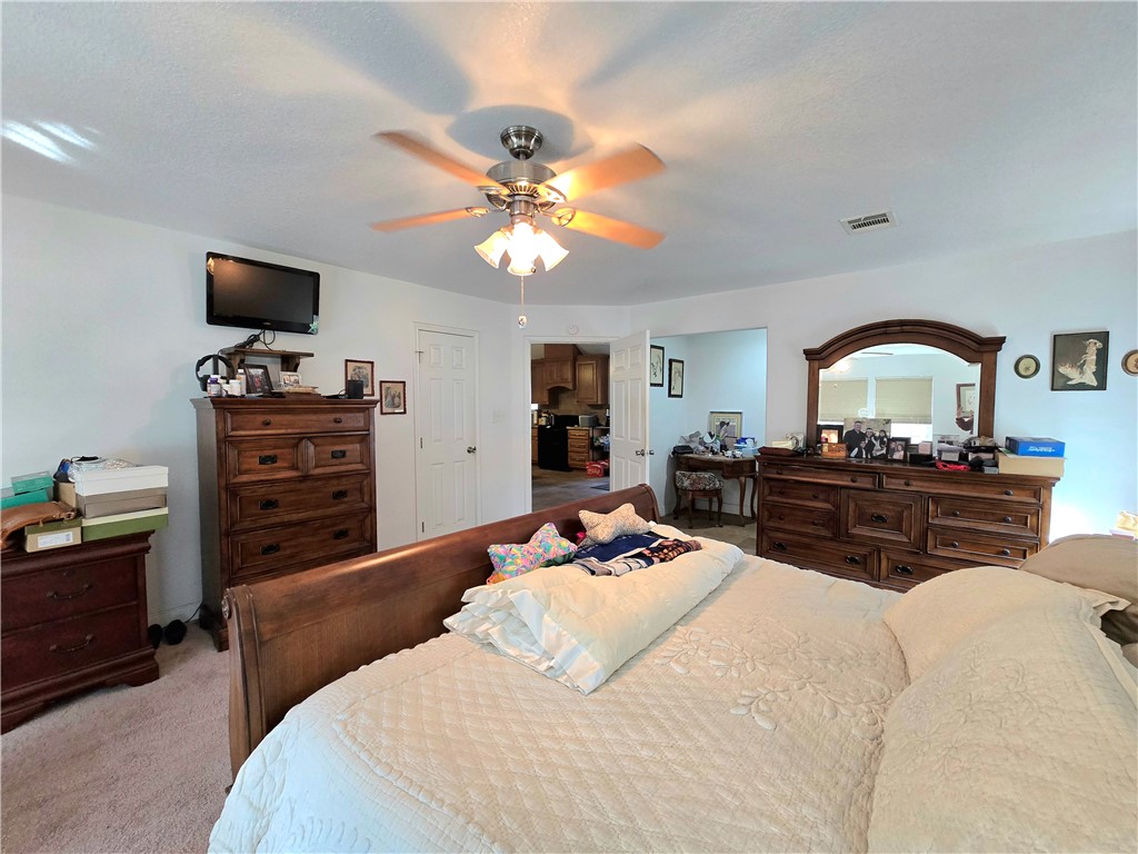 402 Shadow Arbor Circle Somerville, TX 77879 - Photo 14 of 26 a bed room with a bed and a television