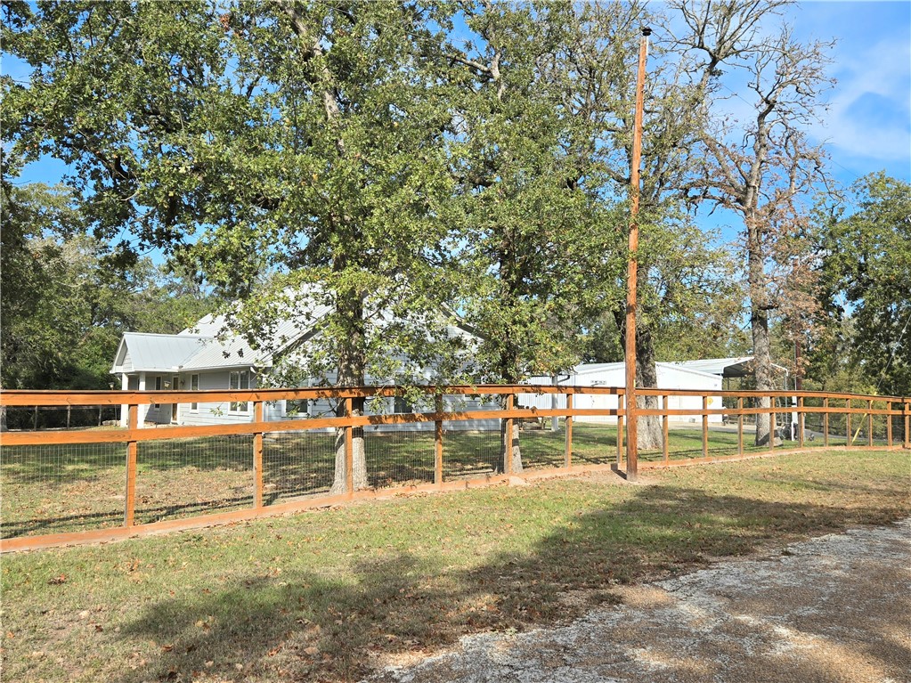402 Shadow Arbor Circle Somerville, TX 77879 - Photo 3 of 26 a view of a yard with a tree