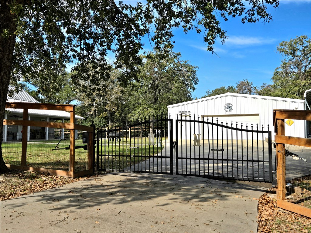 402 Shadow Arbor Circle Somerville, TX 77879 - Photo 4 of 26 a view of a wrought iron fences in front of house