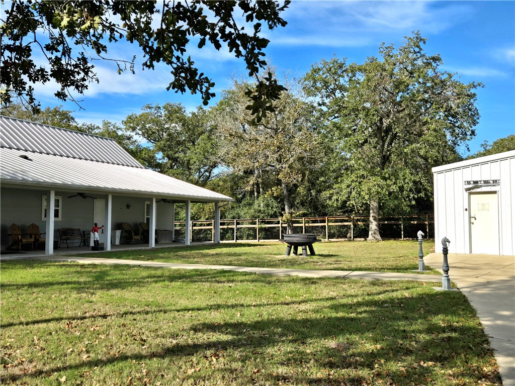402 Shadow Arbor Circle Somerville, TX 77879 - Photo 6 of 26 a view of a white house with a big yard and trees