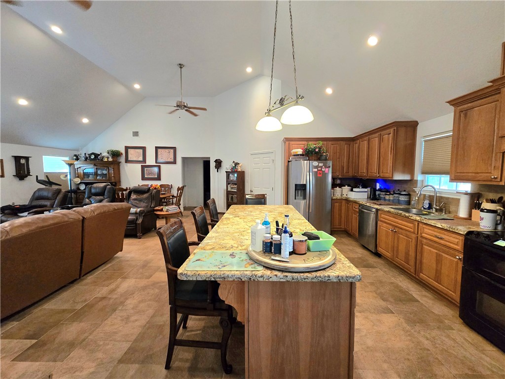 402 Shadow Arbor Circle Somerville, TX 77879 - Photo 10 of 26 a large kitchen with a table and chairs
