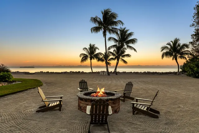 a large building with potted plants in front of it