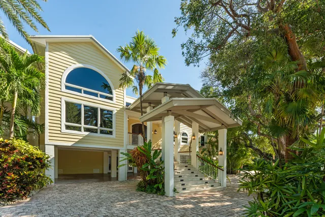 a view of swimming pool with outdoor seating and plants