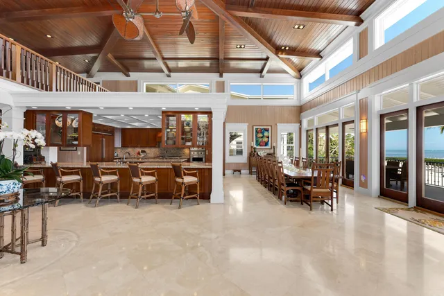 a kitchen with stainless steel appliances granite countertop wooden cabinets a sink and a stove