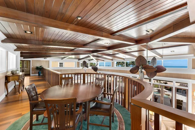 a bathroom with a granite countertop toilet a sink and a mirror